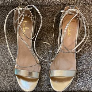 Lulus gold lace up sandals.
